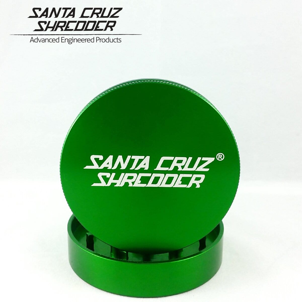 A close-up shot of the Santa Cruz Shredder 2 Piece Medium Grinder, showcasing its metallic, two-part construction.