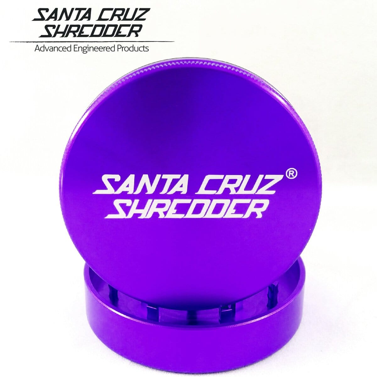 A top-down view of the Santa Cruz Shredder 2 Piece Large Grinder, showcasing its metallic, multi-tiered construction.