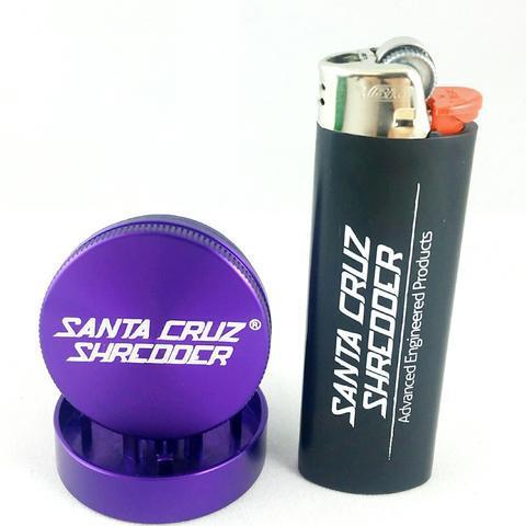 A close-up shot of the purple Santa Cruz Shredder 2 Piece Mini Grinder, viewed from a slight angle against a plain white background.