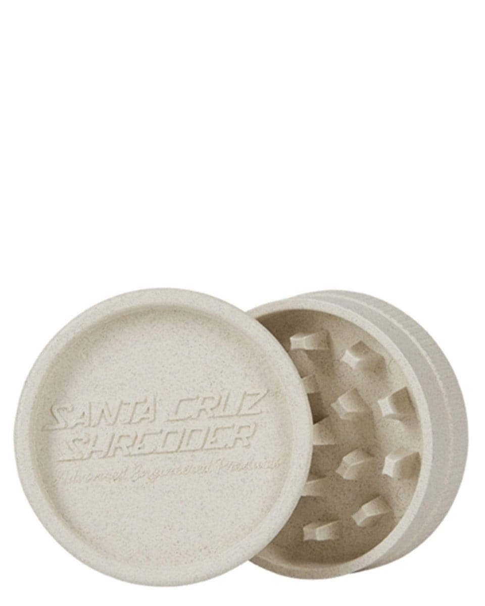 Overhead view of the Santa Cruz x G Pen Hemp Grinder, showing its two textured metal grinding plates slightly separated.