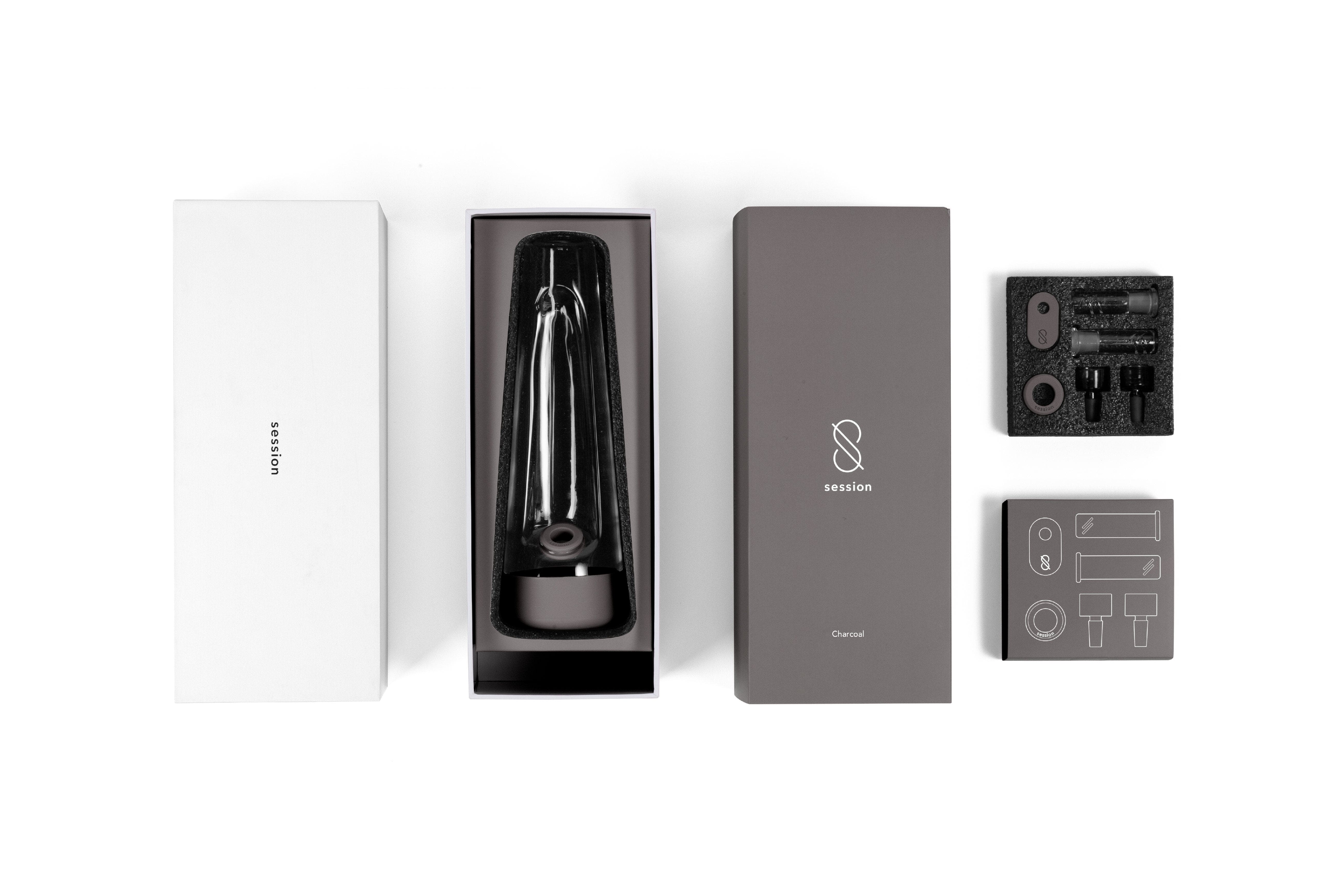 Top-down view of the Session Goods Modern Bong and its charcoal-colored packaging and accessories neatly arranged on a white background.