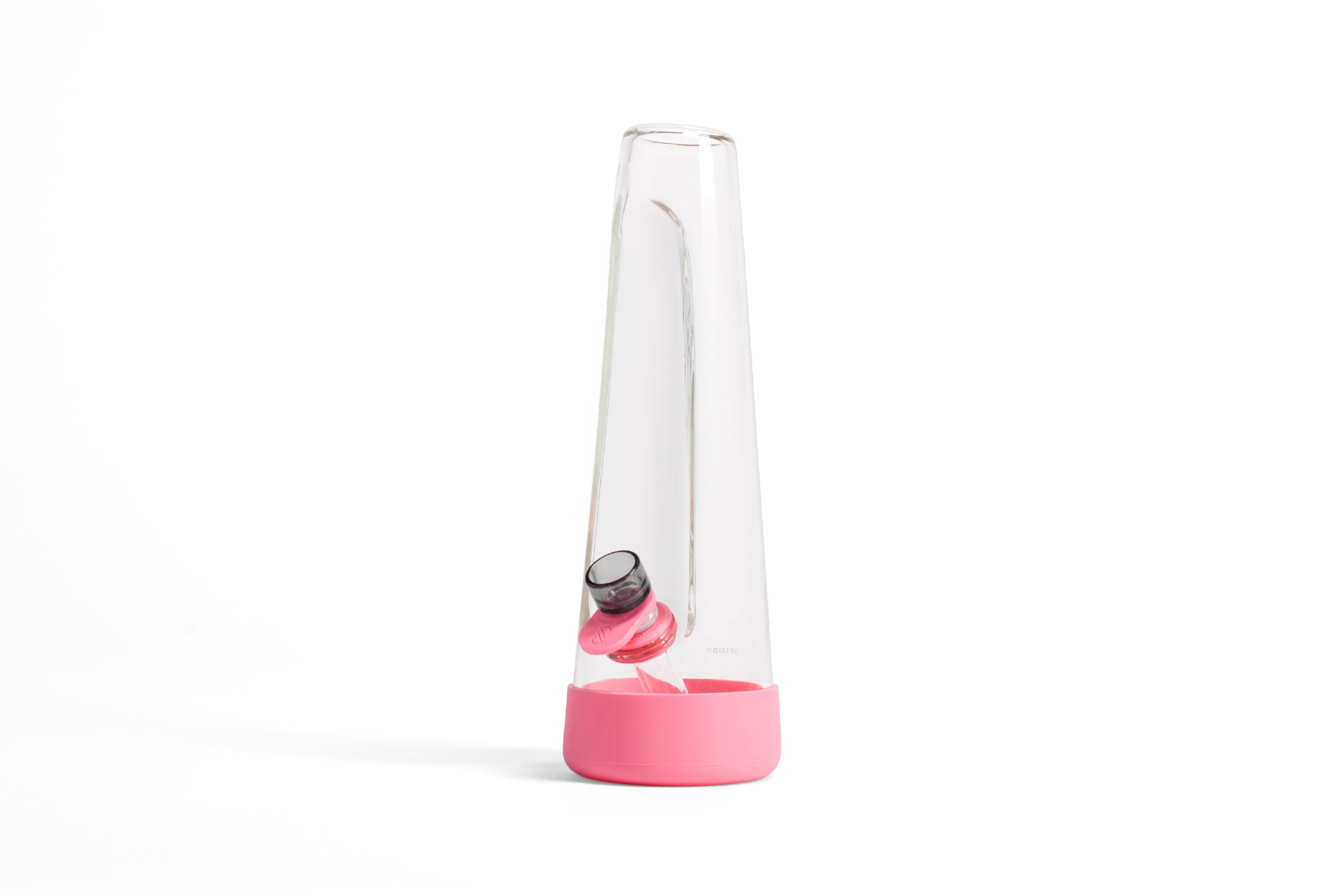 Angled studio shot of the clear Session Goods Modern Bong with a pink silicone base and downstem against a white background