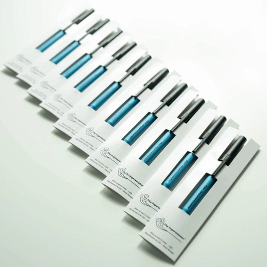 A high-angle shot of ten The Impersonator 10-Pack items, arranged in a descending line on a clean white surface.