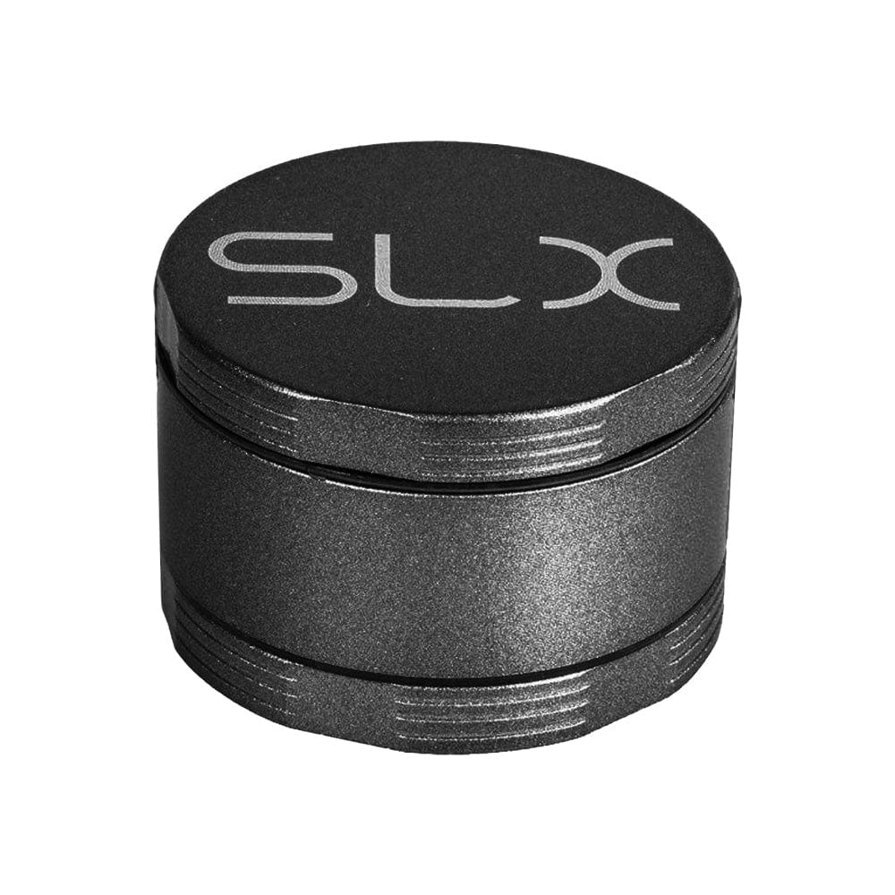 A close-up, angled view of the SLX Ceramic Coated Metal Grinder, a dark, four-piece metal grinder measuring approximately 2 inches.