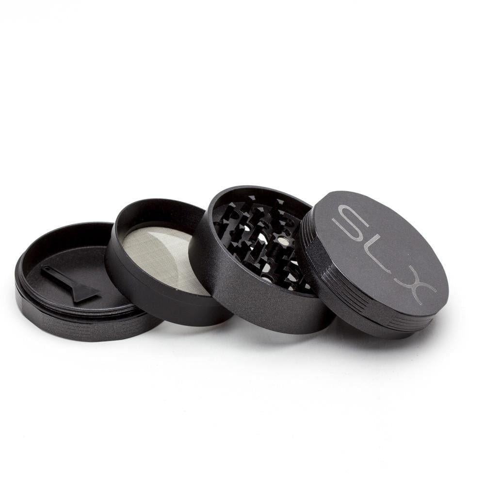 A disassembled SLX Ceramic Coated Metal Grinder, showing its four metallic pieces arranged in a row against a plain white background.