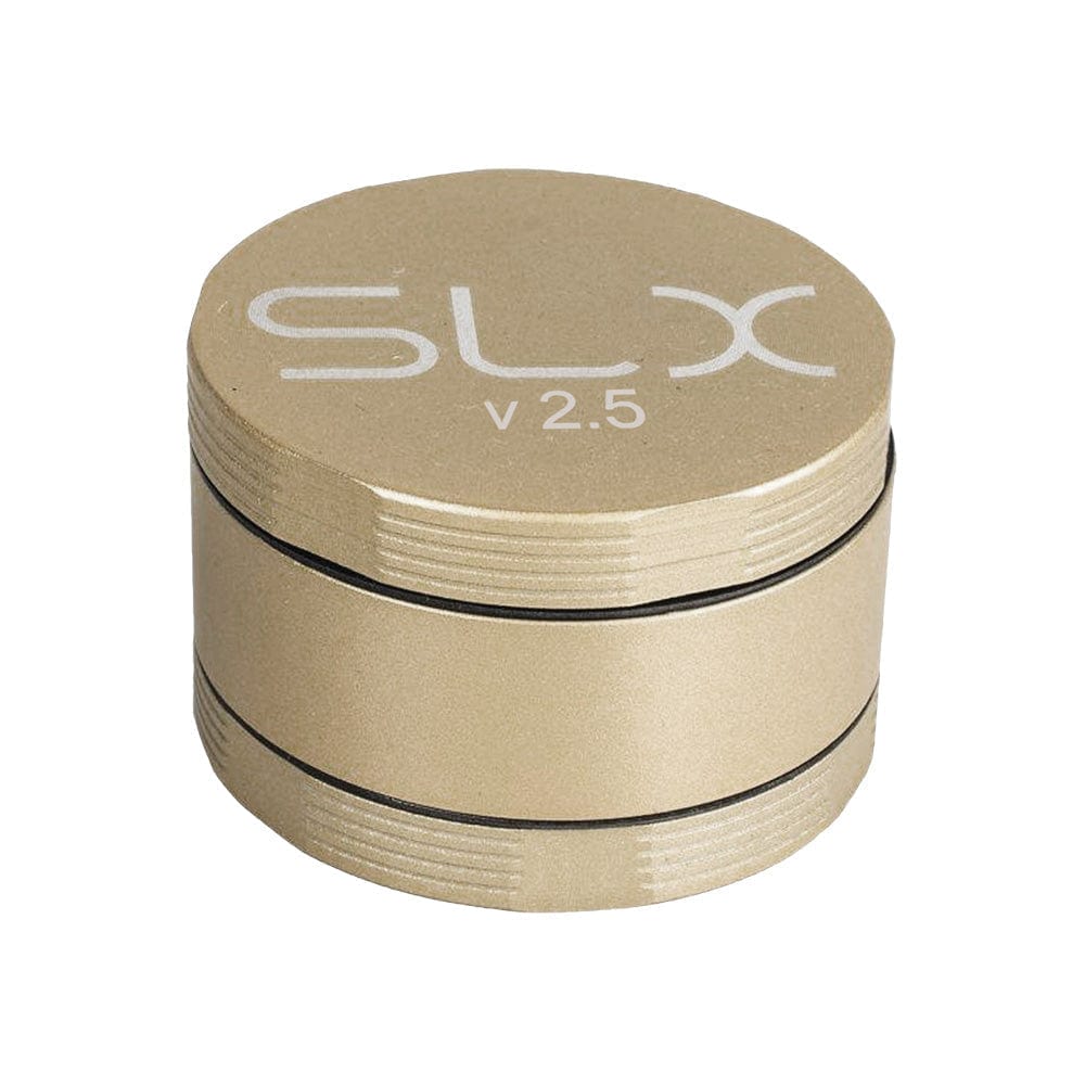 A close-up, angled view of the SLX Ceramic Coated Metal Grinder, showcasing its circular, metallic finish.