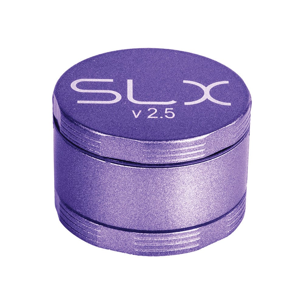 A close-up, angled view of the SLX Ceramic Coated Metal Grinder, showing its metallic, four-piece construction.