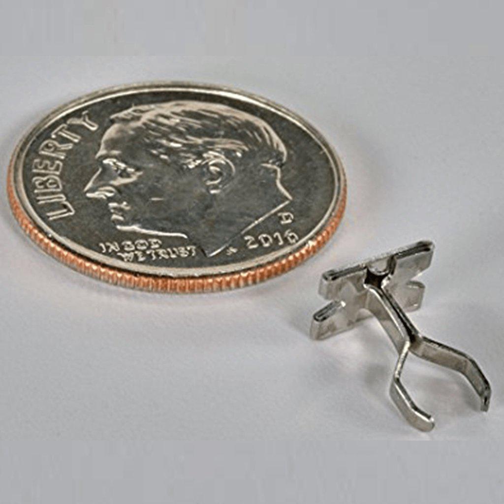 A close-up shot of the silver-colored Smojo Screen, positioned against a blurred background featuring a portion of a coin.
