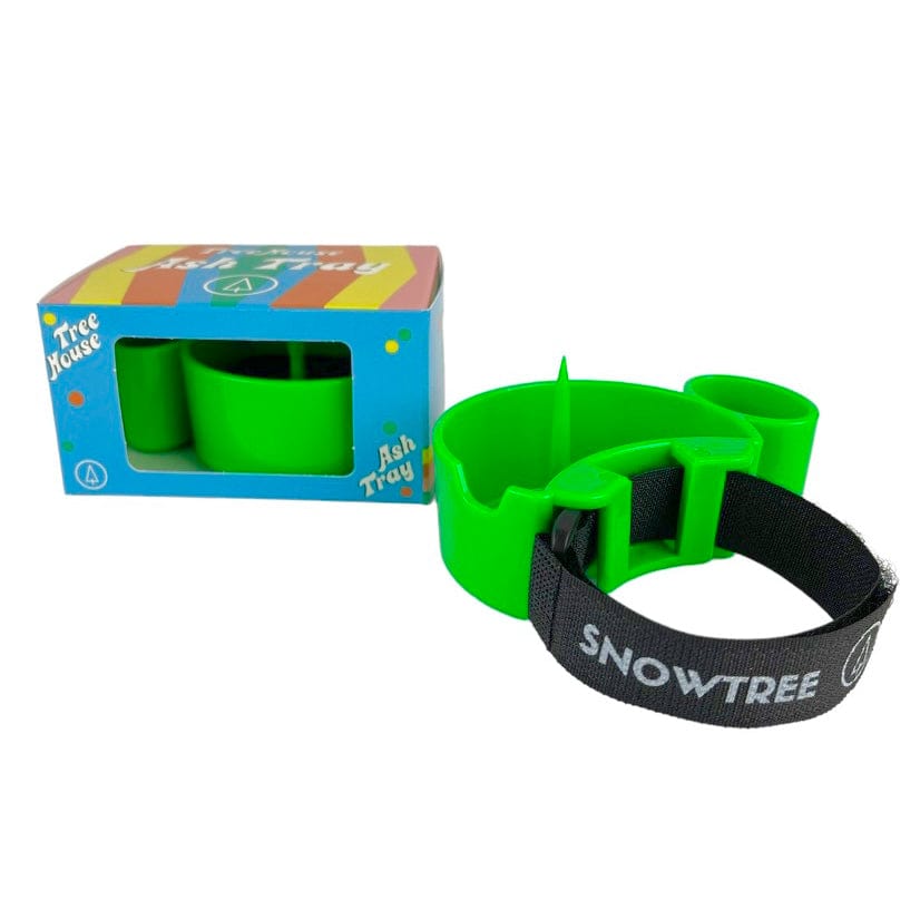 A close-up, angled view of the TreeHouse AshTray, a simple, circular tray in a neutral tone against a white background.