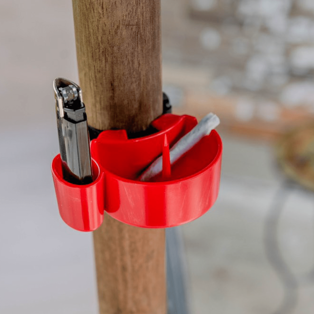 A side view shows the TreeHouse AshTray attached to a wooden pole, containing a used cigarette filter.