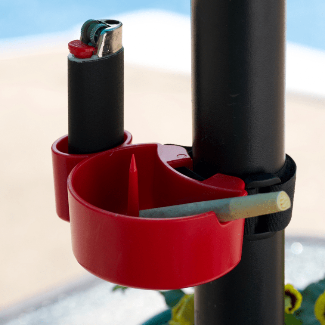 A side view shows the red TreeHouse AshTray clipped onto a black pole against a blurred, bright background.