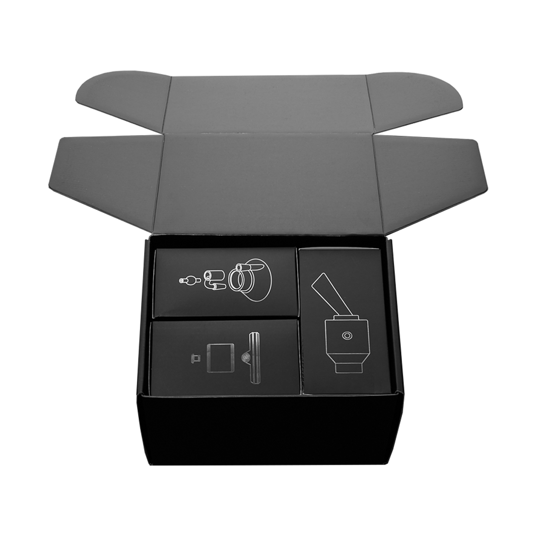 The Tandem Rig Kit is displayed in its open black cardboard packaging, highlighting its components within.