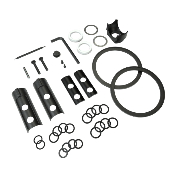 A top-down view of the Stündenglass Maintenance & Seal Kit components, including rubber o-rings and glass pieces, arranged on a white background.