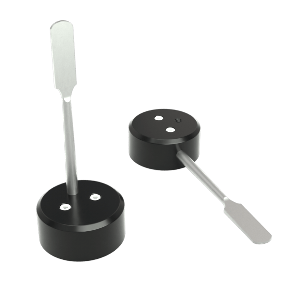 Front view of the Stündenglass Modül for Dry Material, showing a black cylindrical base with a slender, silver-colored attachment.