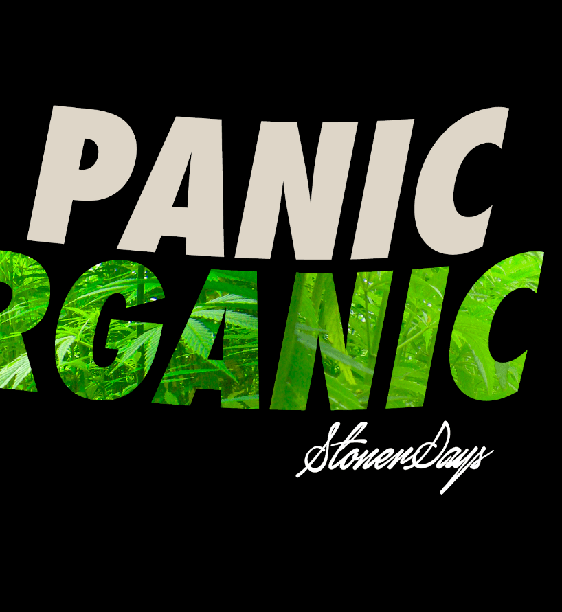 A close-up of the Dont Panic Greens Tee displaying bold, graphic lettering against a dark background.