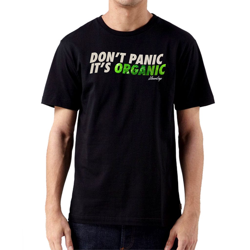 Front view of the Dont Panic Greens Tee, a dark garment with white lettering in a simple, bold font.