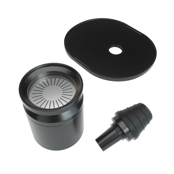 Angled top-down view of the Infusion Chamber Assembly showing three matte black components—a cylindrical chamber with radial filter, a flat oval lid with center hole, and a stepped connector—on a white background