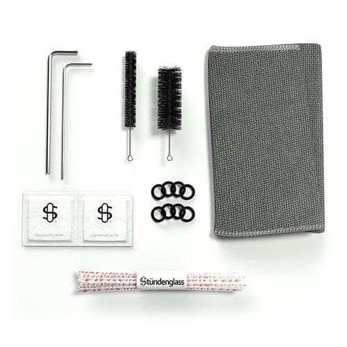 A top-down view of the Cookies X Stündenglass Gravity Infuser with a dark gray case and silver metallic rods, laying on a white background.