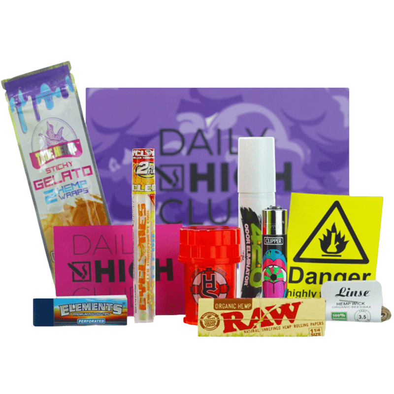 Front view of the Connoisseur V2 packaging amongst various colorful papers and a lighter, presenting a smoking accessory setup.