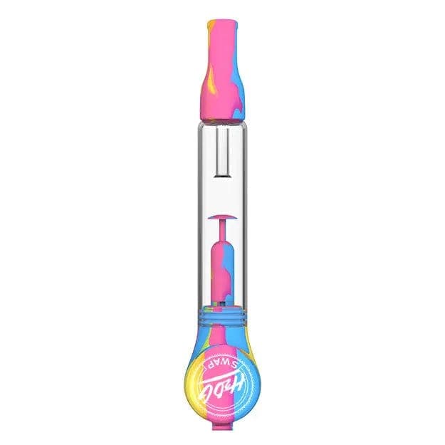 Straight-on studio view of the H20G SWAP Silicone and Glass Bong showing a clear glass chamber with a colorful pink, blue, and yellow silicone mouthpiece and base.