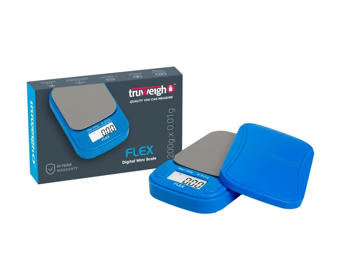 A close-up, angled view of the Truweigh Flex Mini Scale, displaying a digital readout on its sleek black surface.