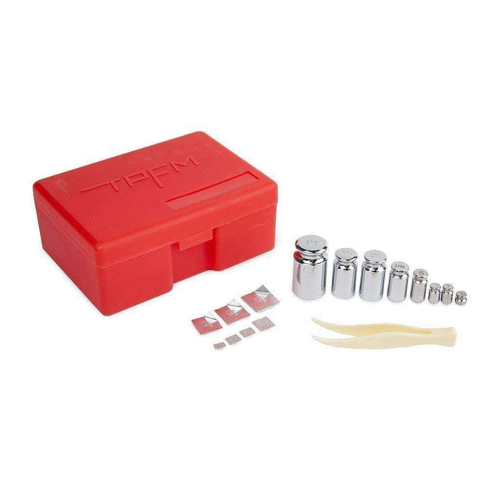 Front view of the Calibration Weight Kit / 16 Pc (Red) neatly arranged in a red case, showcasing the various metallic weights inside.