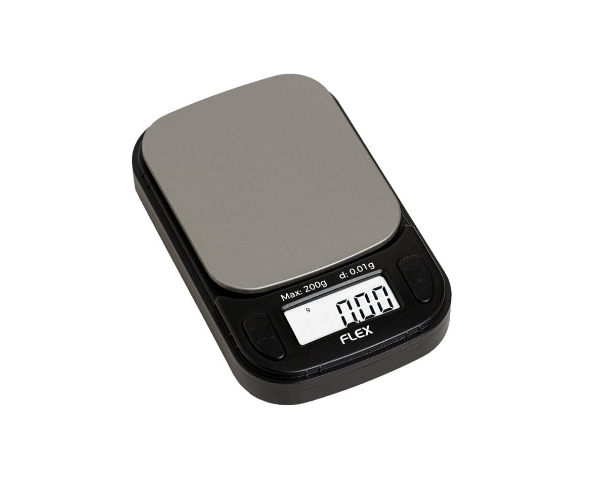 A close-up, angled view of the Truweigh Flex Mini Scale, displaying a digital readout on its sleek, black surface.
