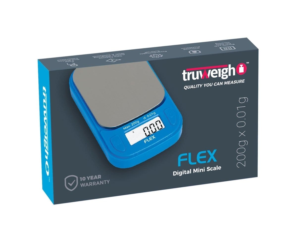 A close-up, angled view of the Truweigh Flex Mini Scale, displaying a digital readout on its sleek, black surface.
