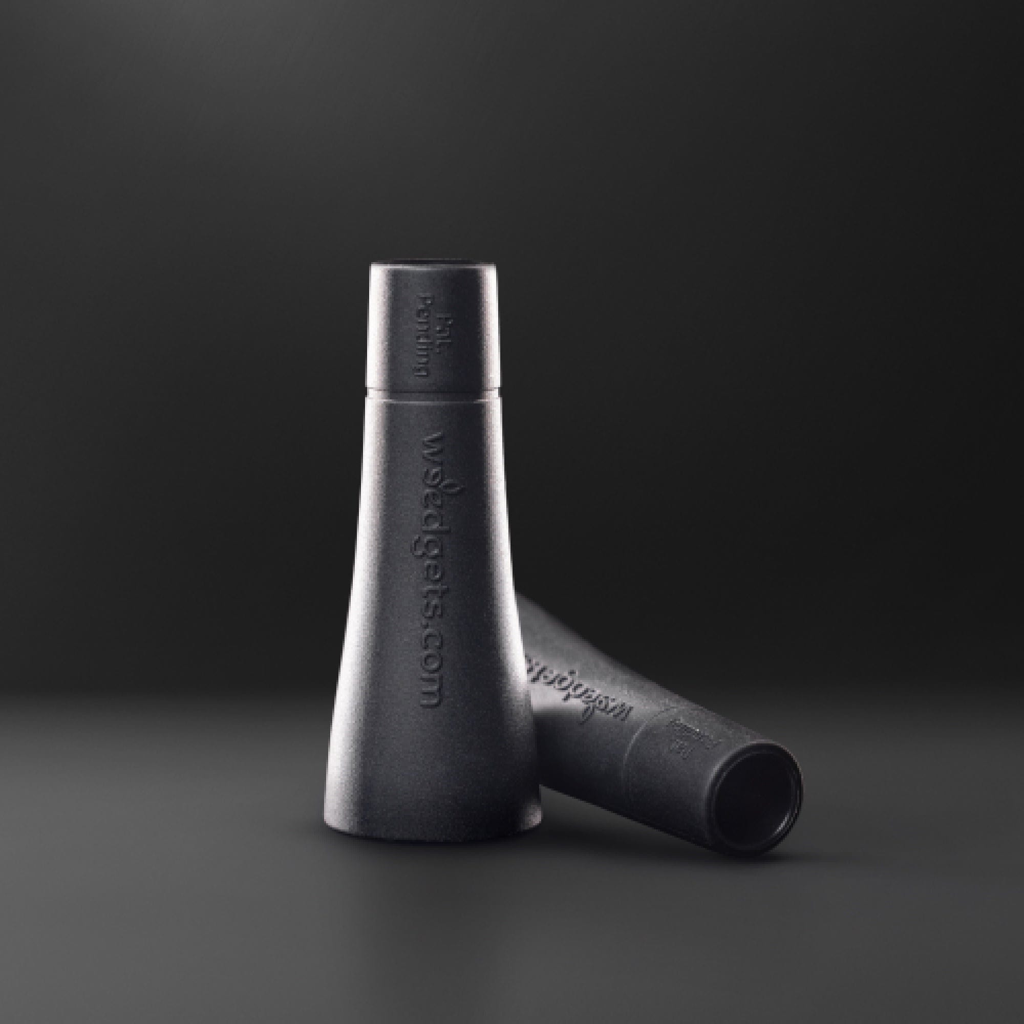 A close-up angled view of the Tic-Toke Filter Tips - MEDIUM set of 2| showing the dark-colored filters positioned side-by-side.