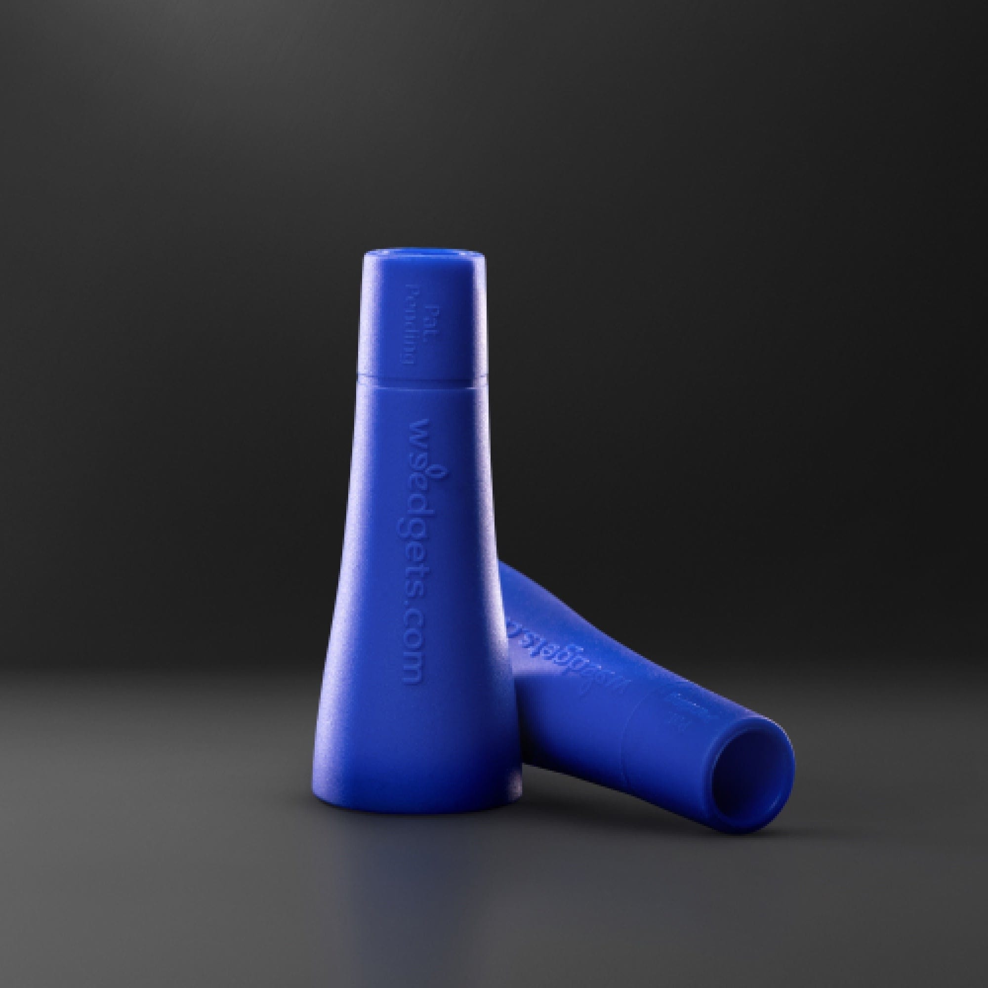 A close-up shows the set of two MEDIUM Tic-Toke Filter Tips, angled against a dark backdrop highlighting their smooth, cylindrical form.