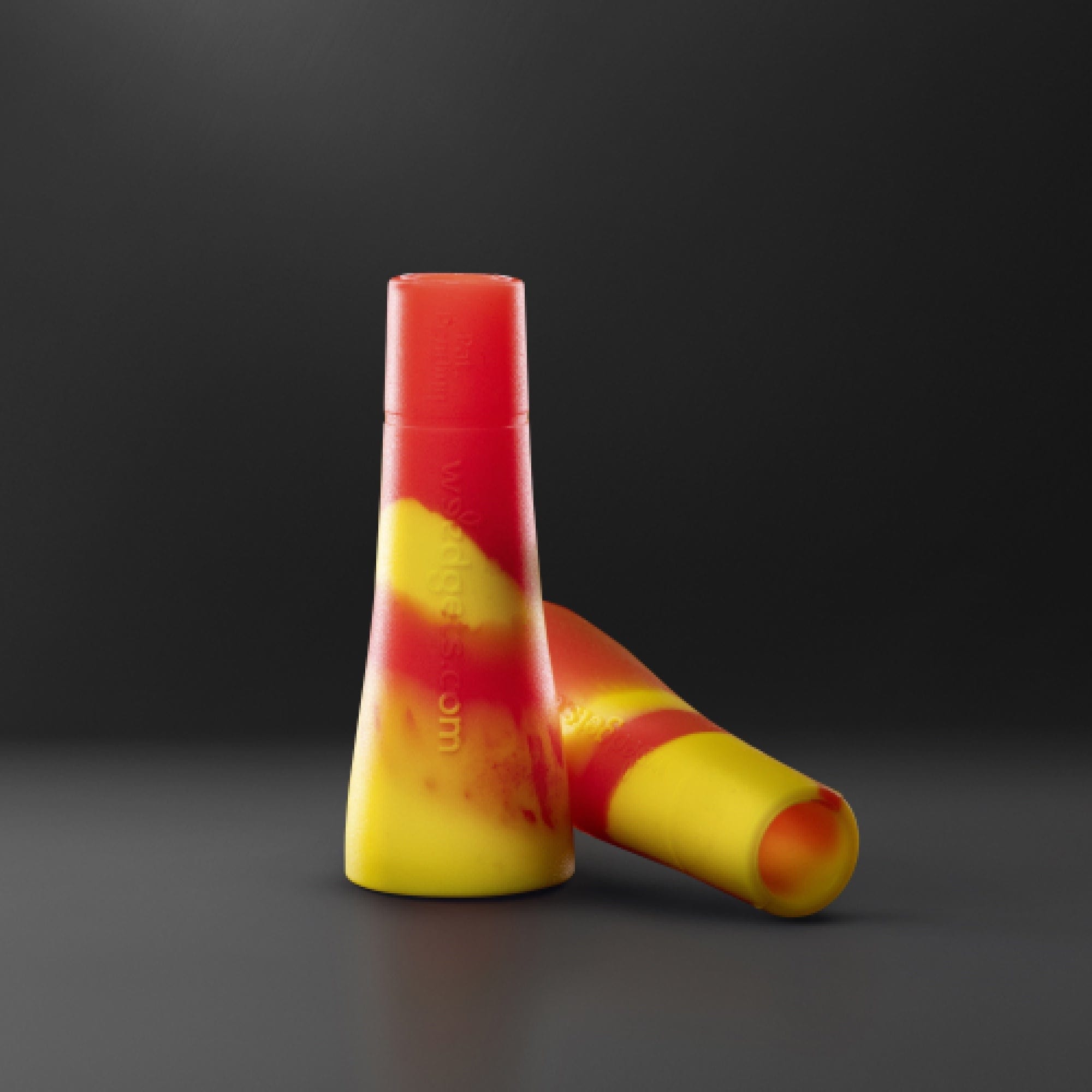 A close-up, angled view of the Tic-Toke Filter Tips - MEDIUM set of 2| showcasing their smooth, orange-toned design against a dark background.