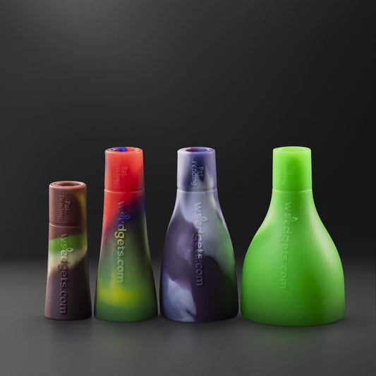 Front view of the Tic-Toke Starter Pack, showcasing four differently sized, colorful glass pipes arranged on a dark background.