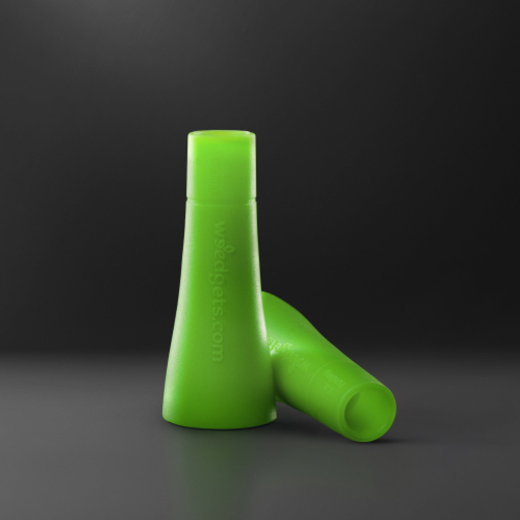 A slightly angled view of the two green Tic-Toke Filter Tips - MEDIUM, against a dark background, showcasing their cylindrical shape.