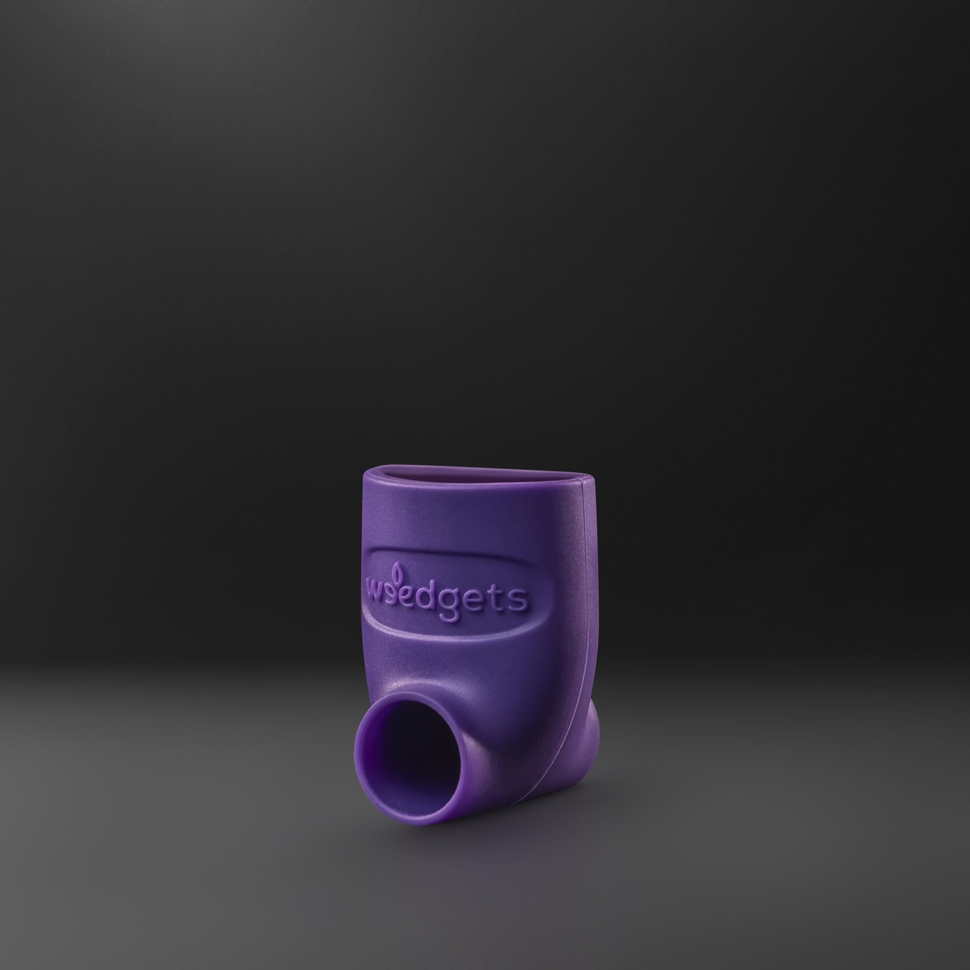 A slightly angled, close-up view of the purple SILI-SCOOP - BOWL LOADING & TAMPING TOOL against a black background.
