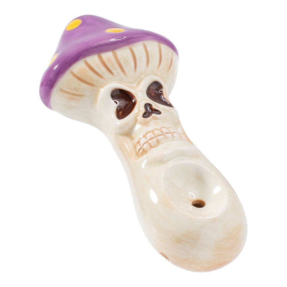 Front view of the Skull Mushroom Ceramic Pipe, a white, mushroom-shaped pipe with a detailed skull design.