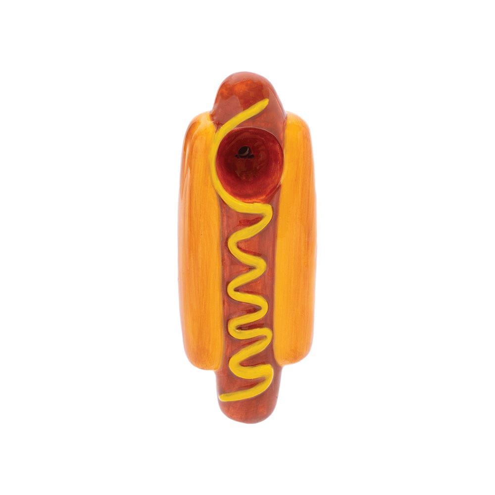 A studio shot of the Wacky Bowlz Hot Dog Ceramic Hand Pipe, resembling a cartoonish hotdog with visible ceramic texture.