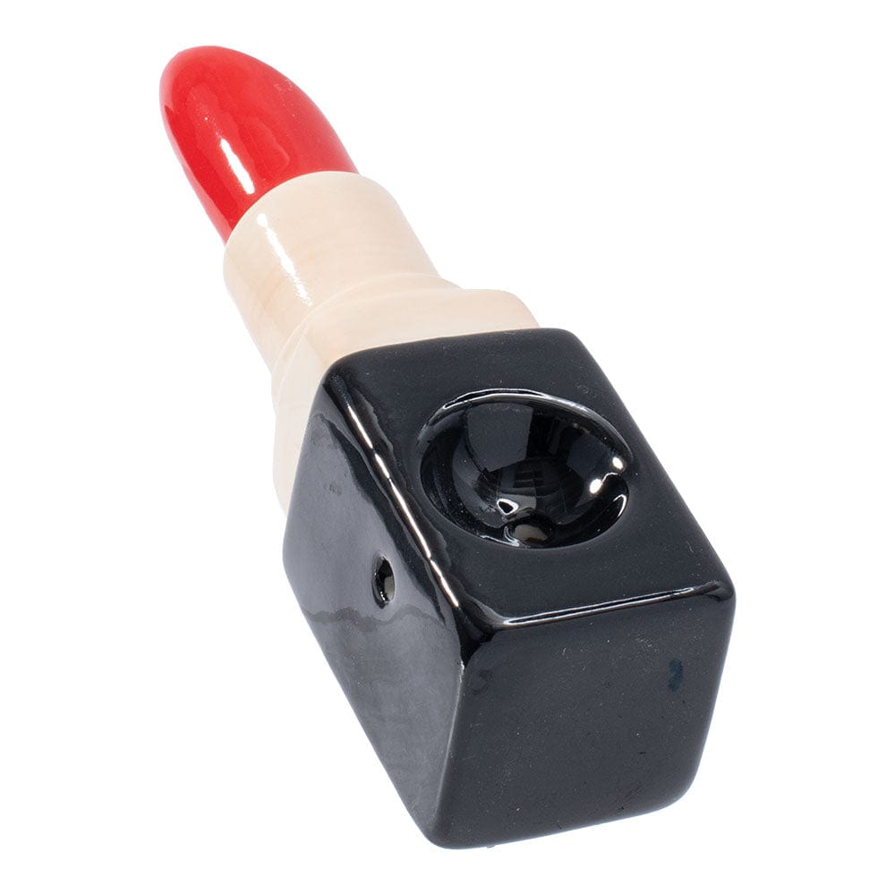 A close-up, angled view of the Wacky Bowlz Lipstick Ceramic Hand Pipe, resembling a lipstick tube in a light pink hue.